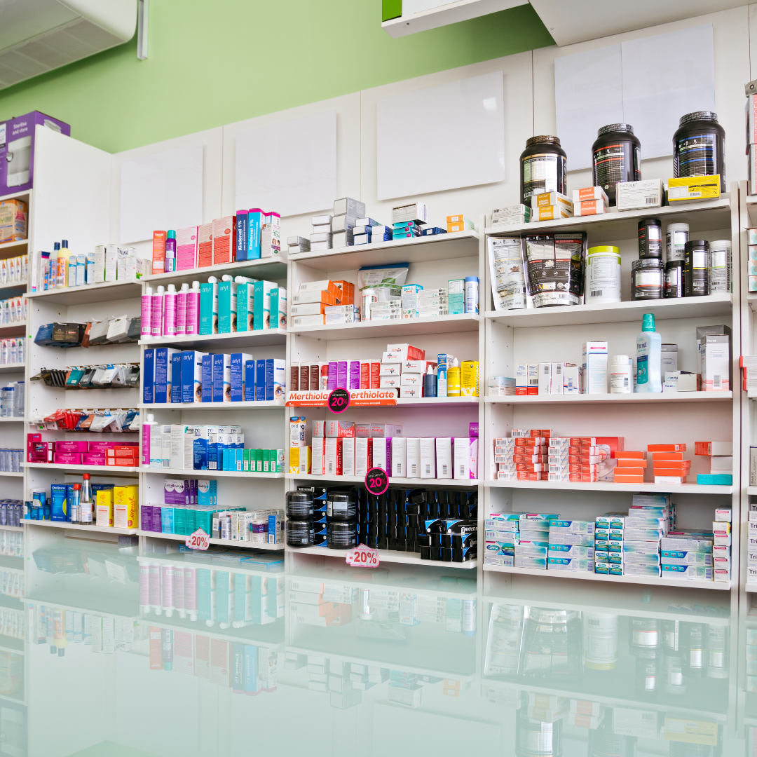 Pharmacy shelves stocked with medications and products.